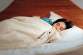 Woman Wearing Pajamas Sleeping in Her Bedroom Royalty Free Stock Photo