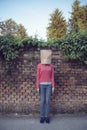 Woman wearing paper bag