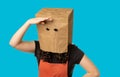 Woman wearing paper bag over her head Royalty Free Stock Photo