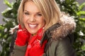 Woman Wearing Parka Coat And Scarf In Studio