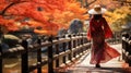 Woman wearing pink kimono on Wooden bridge in the autumn park, Japan autumn season, Kyoto Japan