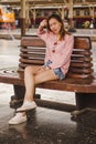 Woman sitting in a chair in a train station Royalty Free Stock Photo