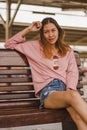 Woman sitting in a chair in a train station Royalty Free Stock Photo