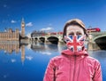 Woman wearing protection face mask with British flag against coronavirus in front of Big Ben, London, England Royalty Free Stock Photo