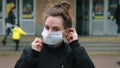 Woman wearing protective mask on the street