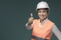 Woman wearing protective workwear and safety helmet