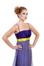 Woman wearing a purple dress with hands on her hip Royalty Free Stock Photo