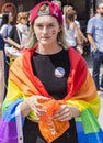 2018: A woman wearing a rainbow flag attending the Gay Pride parade also known as Christopher Street Day CSD in Munich, Germany