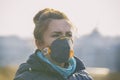 Woman wearing a real anti-pollution, anti-smog and viruses face mask