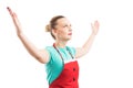 Woman wearing red apron rising lifting both hands Royalty Free Stock Photo