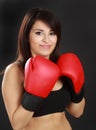 Woman wearing red boxing glove Royalty Free Stock Photo