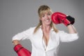 Woman wearing red boxing gloves