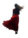 woman wearing a red dress. wind blowing on a dark black hair and red dress. back rear view. full view.