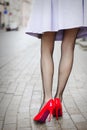 Woman wearing red high heel shoes in city Royalty Free Stock Photo