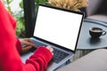 woman wearing red sweater typing on computer at home. female adult sitting on armchair using laptop at cafe. education, working c Royalty Free Stock Photo