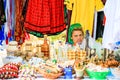 Woman wearing Romanian traditional clothing and selling handmade souvenirs at a food festival in Bucharest, Romania Ã¢â¬â 2019