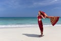 Woman wearing a sari on paradise beach. Royalty Free Stock Photo