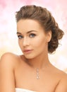 Woman wearing shiny diamond pendant Royalty Free Stock Photo