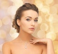 Woman wearing shiny diamond pendant Royalty Free Stock Photo