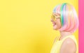 Woman wearing shutter shades sunglasses in a colorful wig