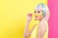 Woman wearing shutter shades sunglasses in a colorful wig