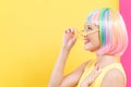 Woman wearing shutter shades sunglasses in a colorful wig