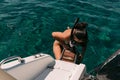 Woman wearing a snorkel mask and climbs stairs in boat Royalty Free Stock Photo