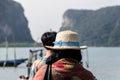 Woman wearing straw hat Go on an island vacation with family. Royalty Free Stock Photo