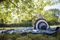 Woman wearing a straw hat in summer nature reading a book Royalty Free Stock Photo