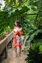 Beautiful young woman wearing summer clothes on tropical resort