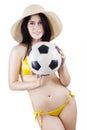 Woman wearing swimsuit and holding ball Royalty Free Stock Photo