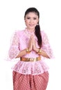 Woman wearing typical thai dress pay respect