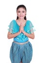 Woman wearing typical thai dress pay respect