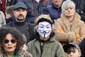 Woman Wearing Vendetta Mask in a Crowd