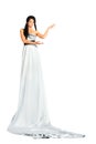 Woman wearing very long silver dress stands Royalty Free Stock Photo