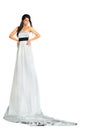 Woman wearing very long silver dress stands Royalty Free Stock Photo