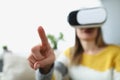 Woman in virtual glasses shows a finger, close-up Royalty Free Stock Photo