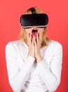Woman wearing virtual reality goggles. Confident young woman adjusting her virtual reality headset and smiling. Woman