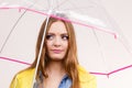 Woman wearing waterproof coat holding umbrella Royalty Free Stock Photo