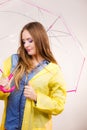 Woman wearing waterproof coat holding umbrella Royalty Free Stock Photo