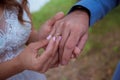 Woman wearing wedding ring on man hand close up Royalty Free Stock Photo