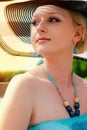 woman wearing white dress and straw hat