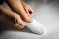 Woman wearing white sock to feet. Royalty Free Stock Photo