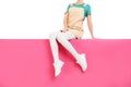 Woman wearing white tights and shoes sitting on color background, closeup Royalty Free Stock Photo