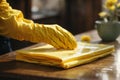 Woman wearing yellow glove and using wet wipe table Royalty Free Stock Photo