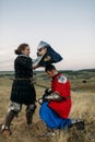 Woman wears a helmet to medieval knight