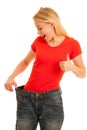 Woman wears too big trousers as she loose weight - weightloss Royalty Free Stock Photo