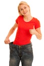 Woman wears too big trousers as she loose weight - weightloss Royalty Free Stock Photo