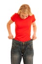 Woman wears too big trousers as she loose weight - weightloss Royalty Free Stock Photo