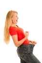 Woman wears too big trousers as she loose weight - weightloss Royalty Free Stock Photo